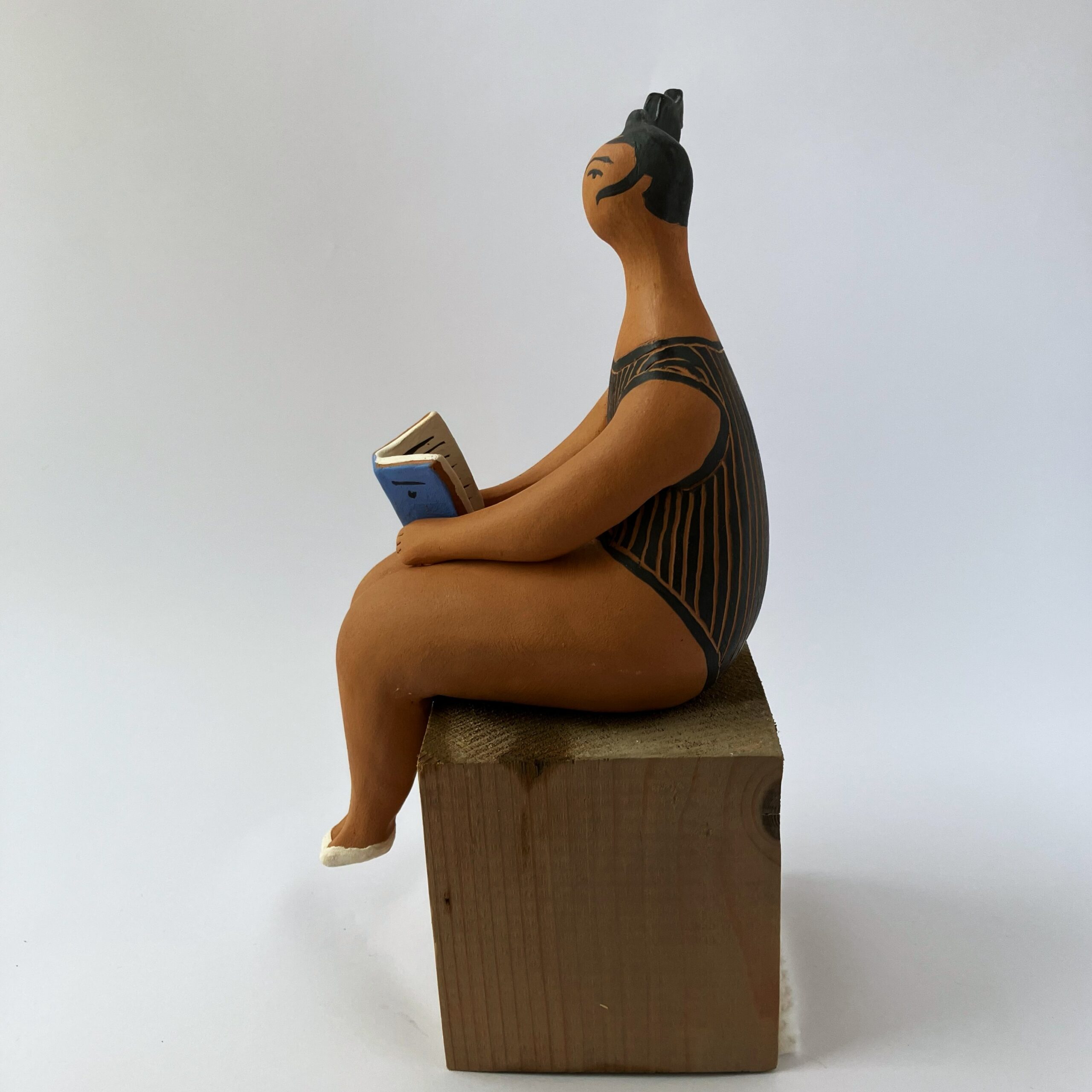“Marinella” terracotta matte finish with book and black striped swimsuit
