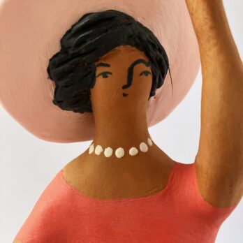 Marinella Figure of Woman Sitting in Pink With Hat