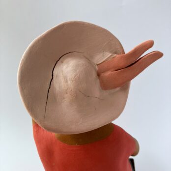 Marinella Figure of Woman Sitting in Pink With Hat