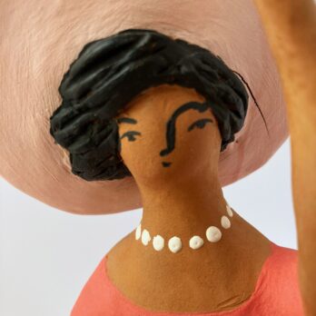 Marinella Figure of Woman Sitting in Pink With Hat